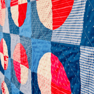 Up close side view of this scrappy modern quilt pattern by Sew Nikki.