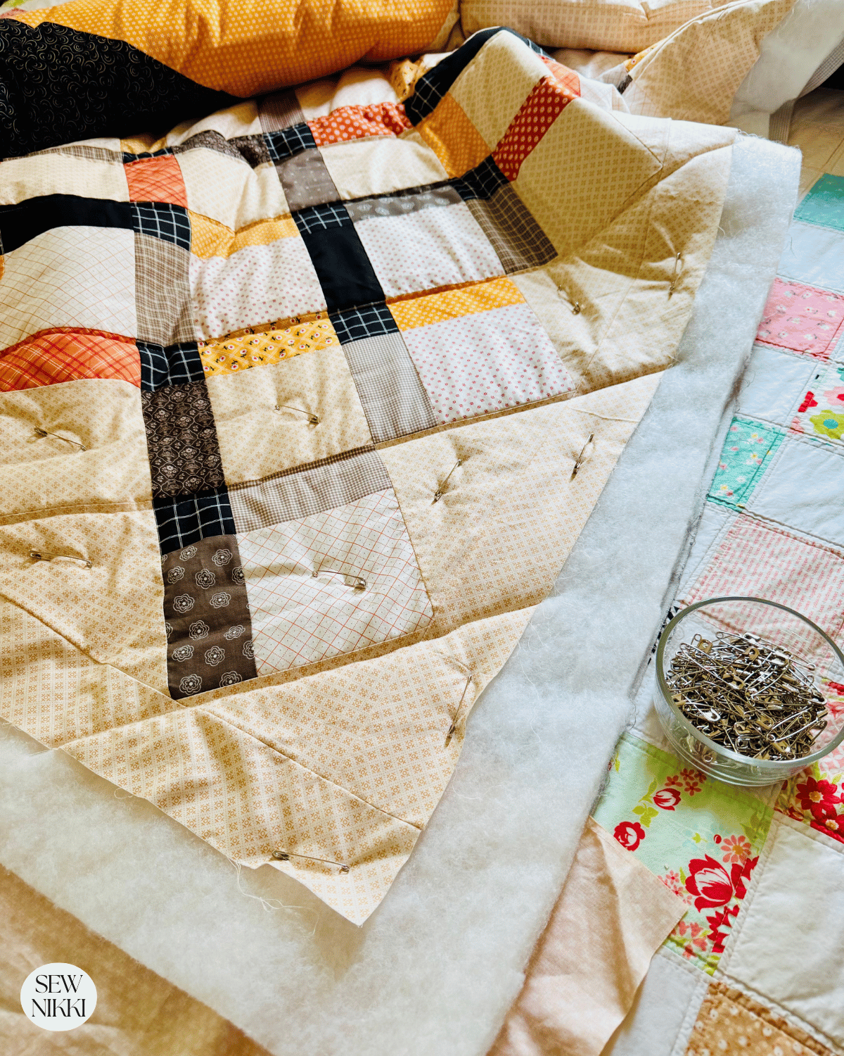 After you have quilted a section and can remove the pins to make sewing easier by Sew Nikki