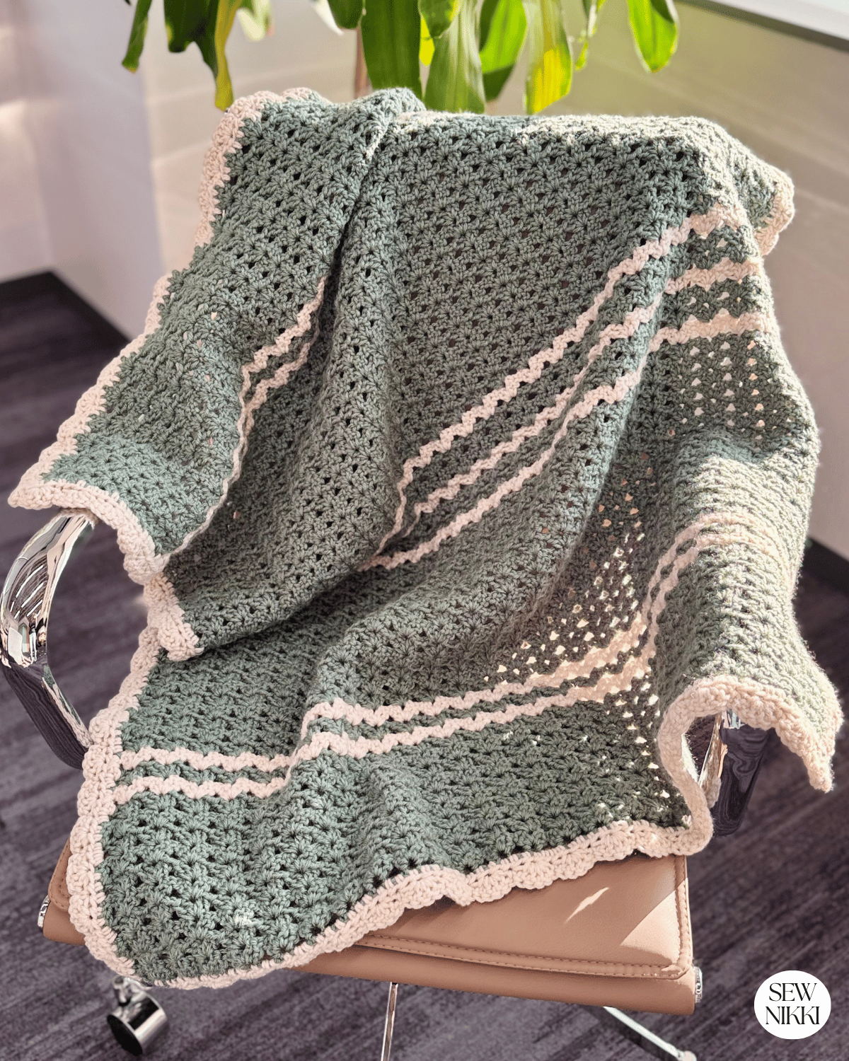 Iris Stitch Baby Blanket Crochet Pattern Free by Sew Nikki - finished blanket over chair.