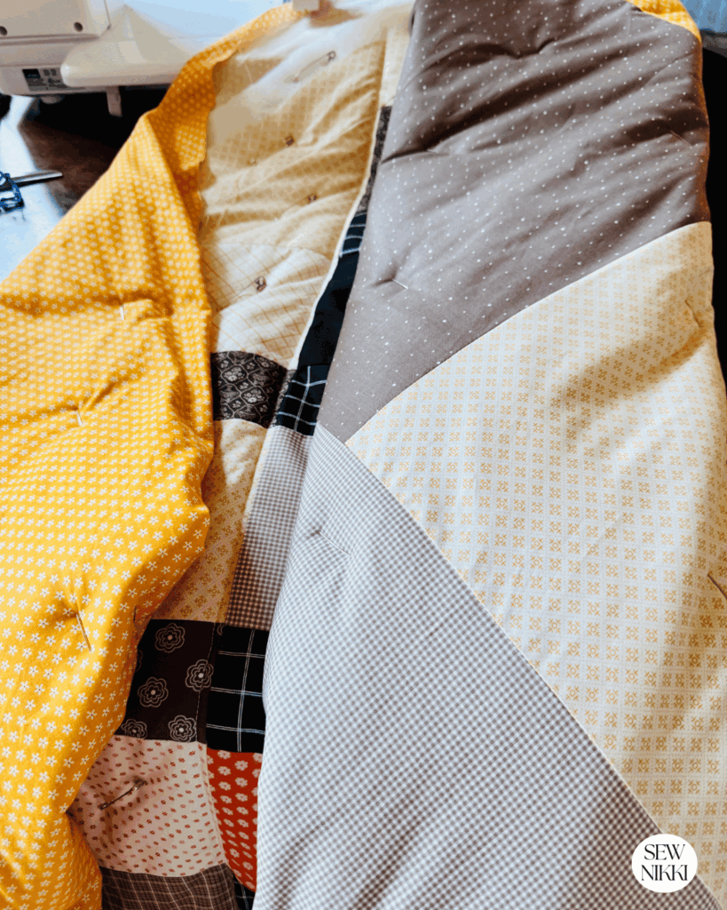 Machine quilting on a home sewing machine by Sew Nikki