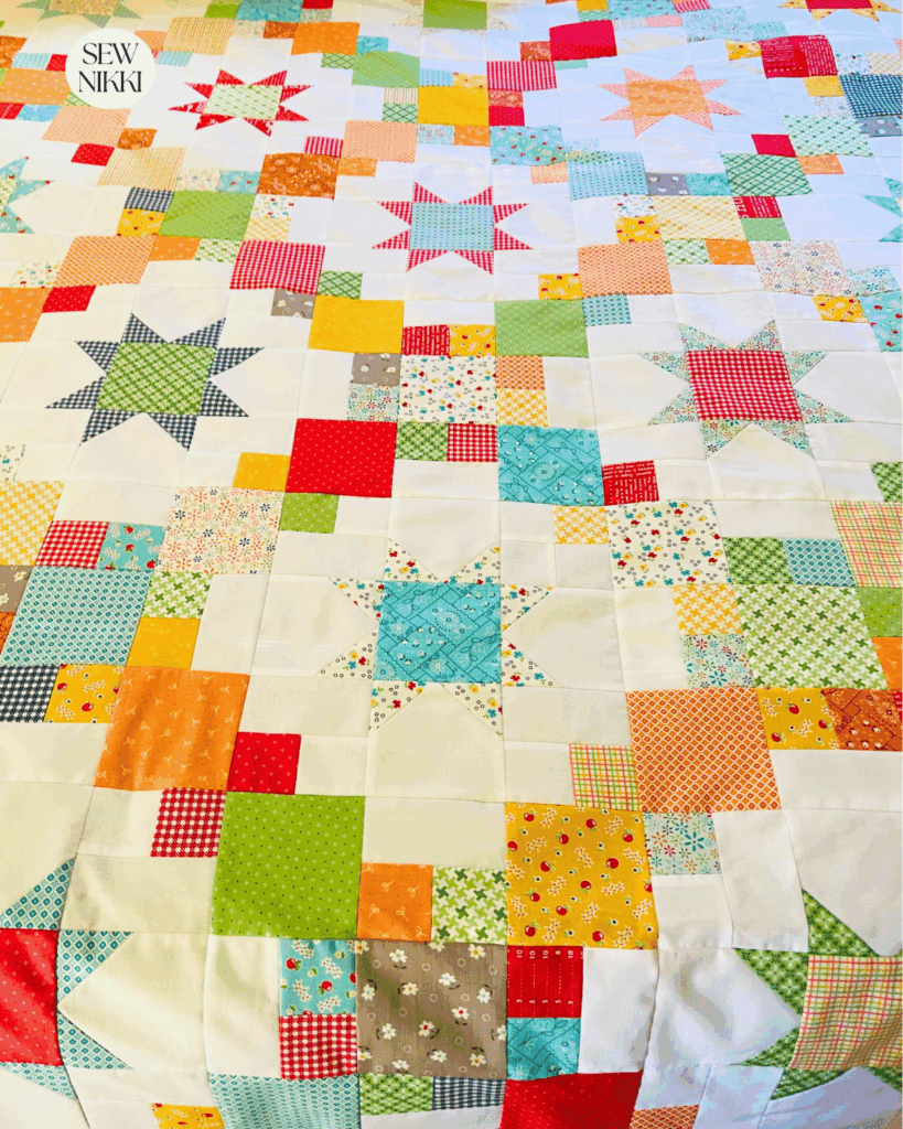 Finished Brightly quilt top by Sew Nikki, pattern by Cluck Cluck Sew