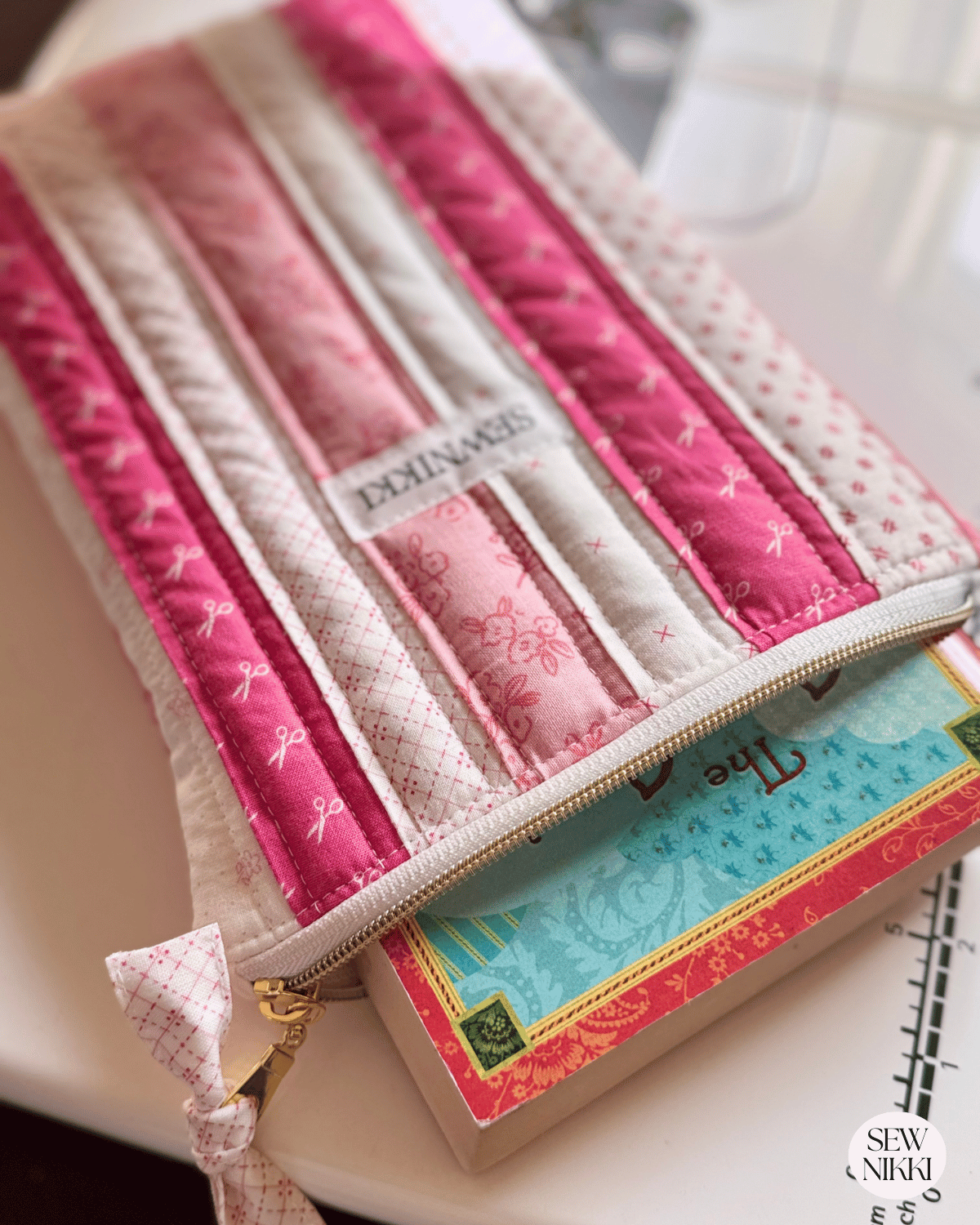 Finished quilted zippered book sleeve free sewing pattern by Sew Nikki