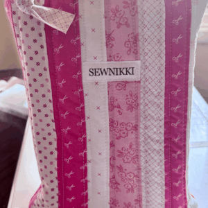 Free Patchwork Book Sleeve Sewing Pattern by Sew Nikki - finished sleeve standing upright.