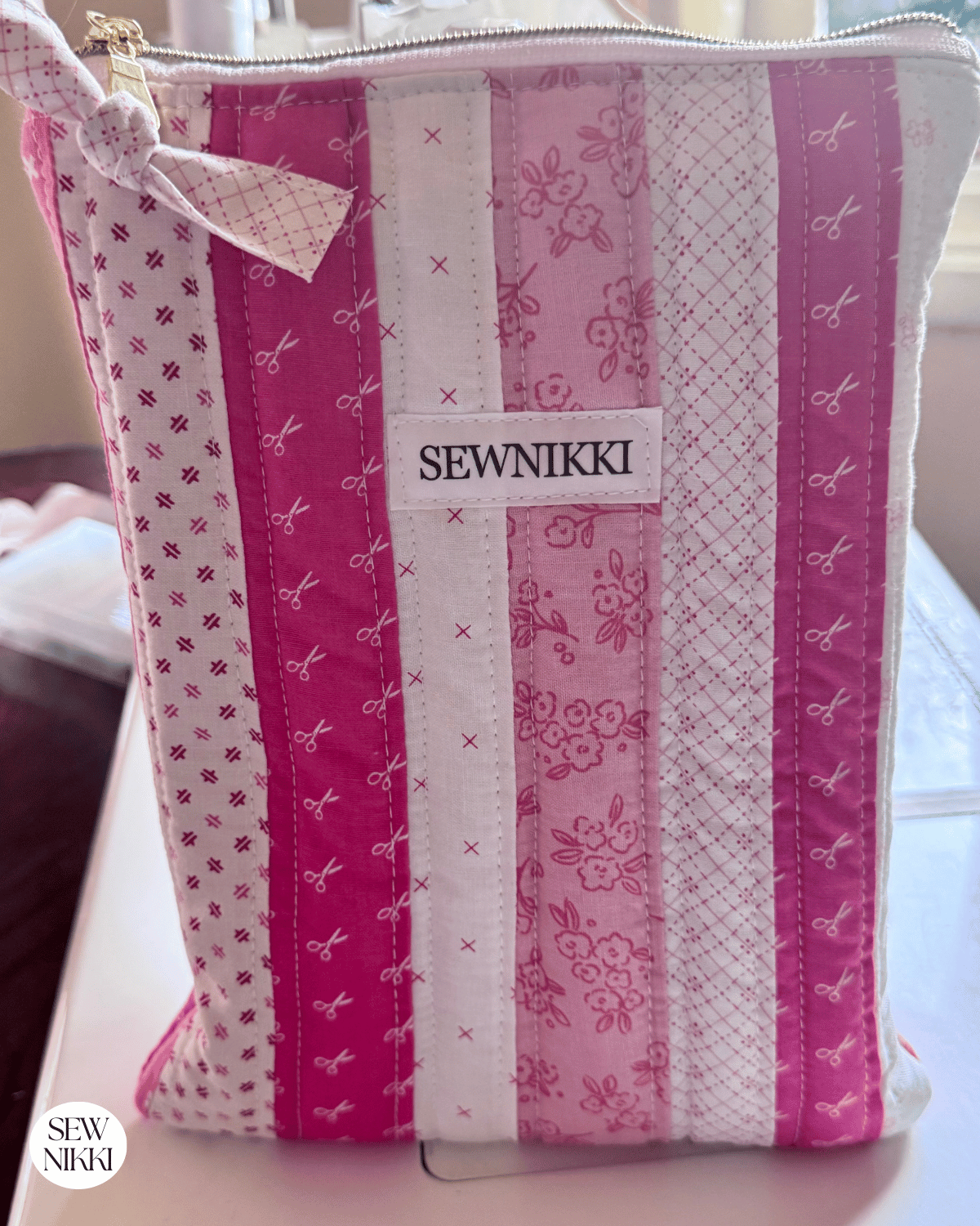 Free Patchwork Book Sleeve Sewing Pattern by Sew Nikki - finished sleeve standing upright.