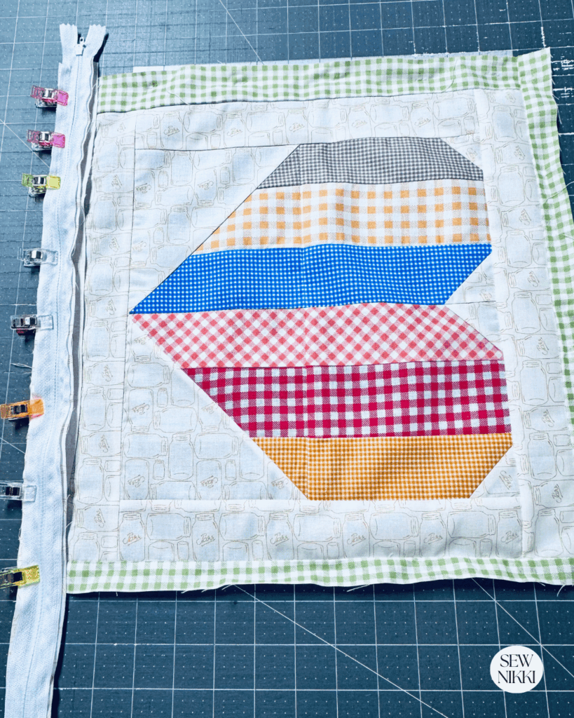 Adding zipper to the bottom of the front pillow panel by Sew NIkki