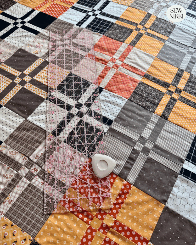 Edge to edge quilting designs don't need to follow the blocks in the quilt top and that can be freeing by Sew Nikki