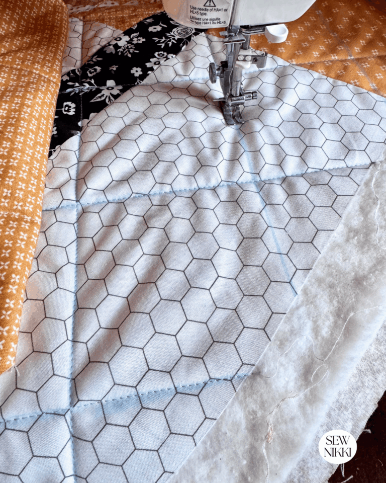 Making a cross hatch quilt design using chalk line grid four inches apart by Sew Nikki