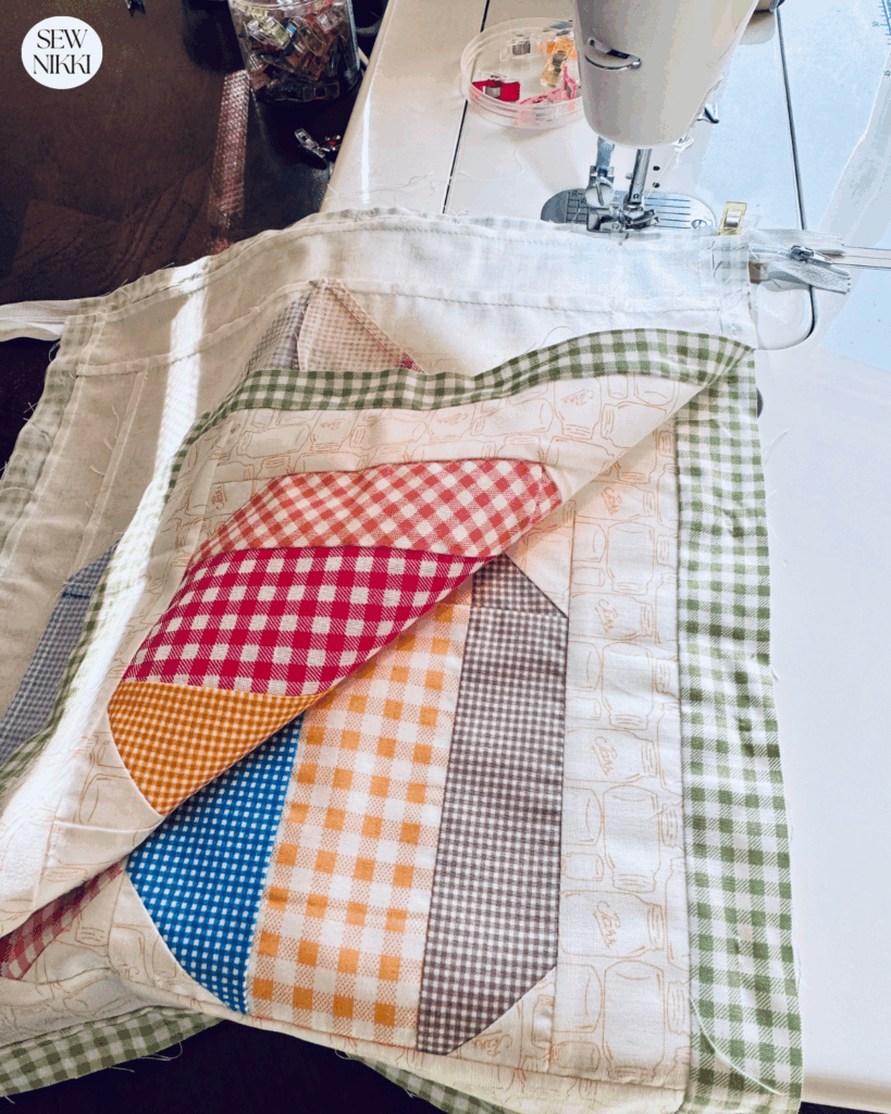 Attaching the back panel to the zipper by Sew Nikki