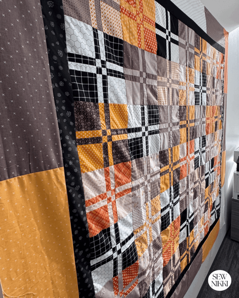 Side view of the finished disappearing four patch quilt pattern by Sew Nikki