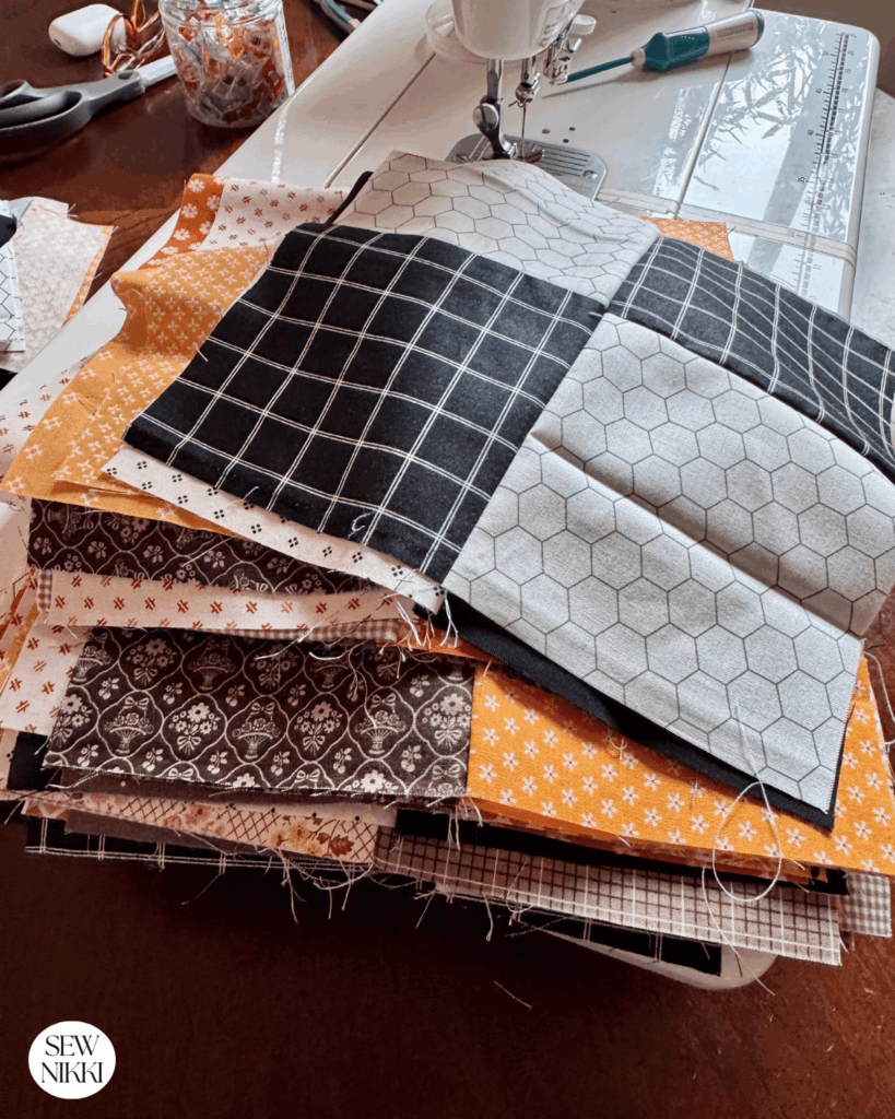 Stack of simple four patch quilt blocks by Sew Nikki