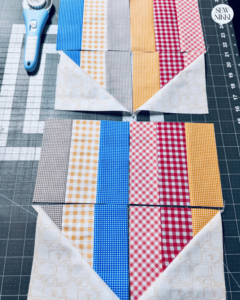 You can lay out 2 heart quilt blocks with the 4 HSTs and 4 square units by Sew Nikki