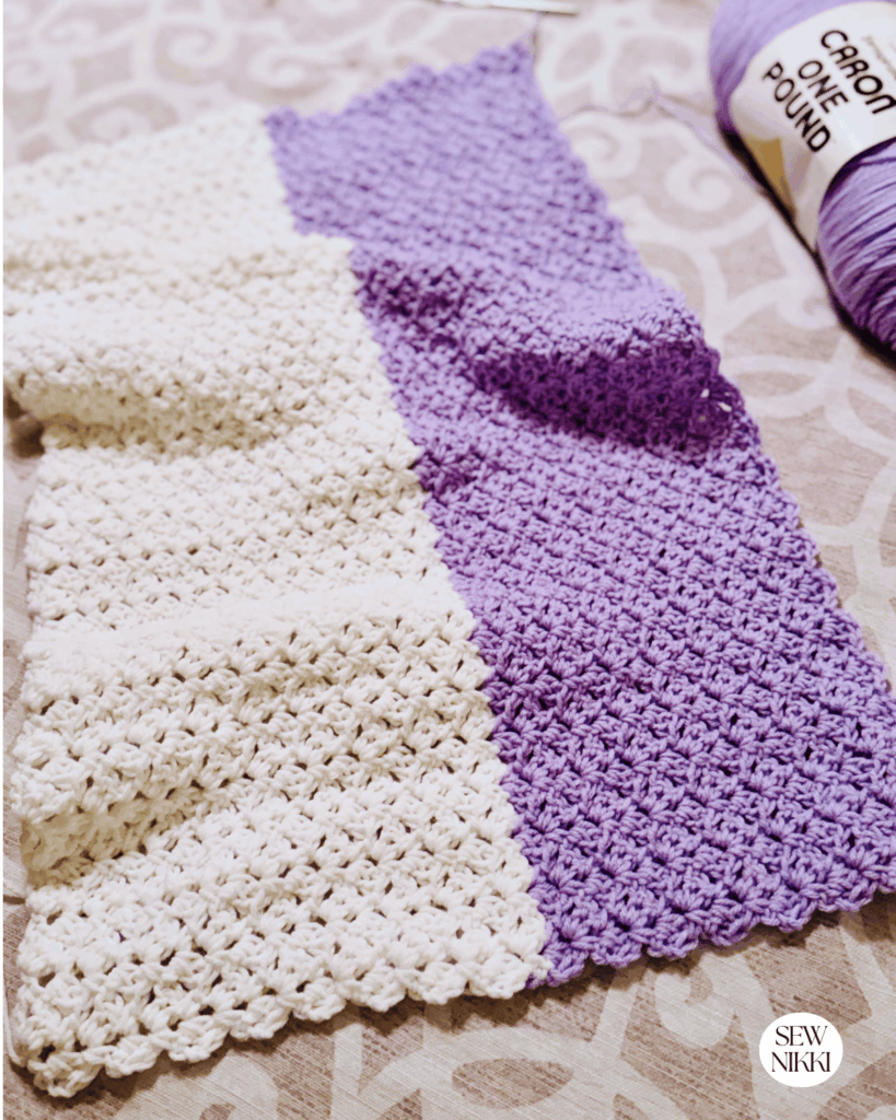 Big stripes in different colors really shows off the reverse blanket stitch crochet pattern by Sew Nikki
