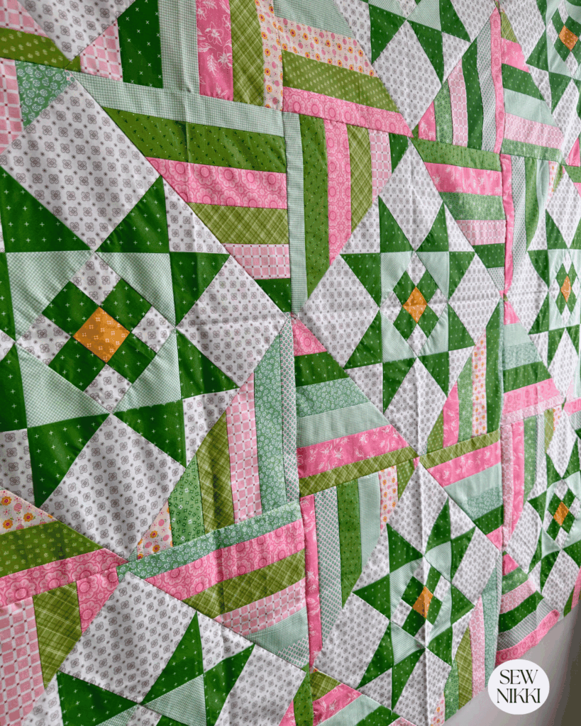 Finished Stars and Stripes quilt top by Sew Nikki view from an angle.