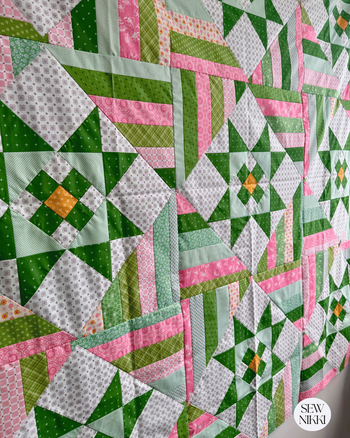 Finished Stars and Stripes quilt top by Sew Nikki view from an angle.