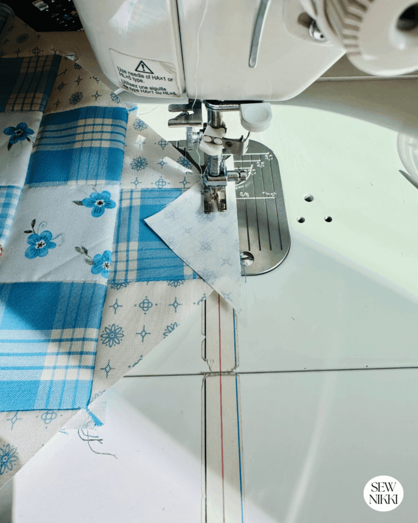 Free Scrappy Granny Square Quilt Block Pattern by Sew Nikki - attaching the corner triangles using a half inch seam allowance.