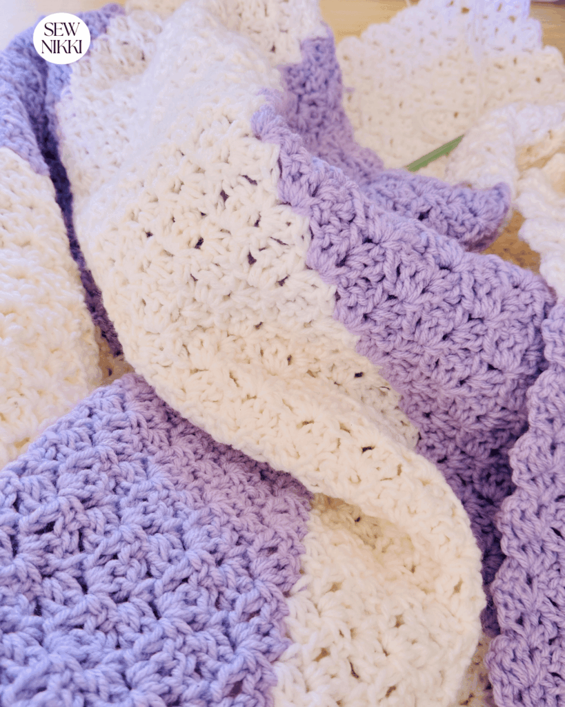 Free crochet lap blanket pattern by Sew Nikki using the reverse blanket stitch. 