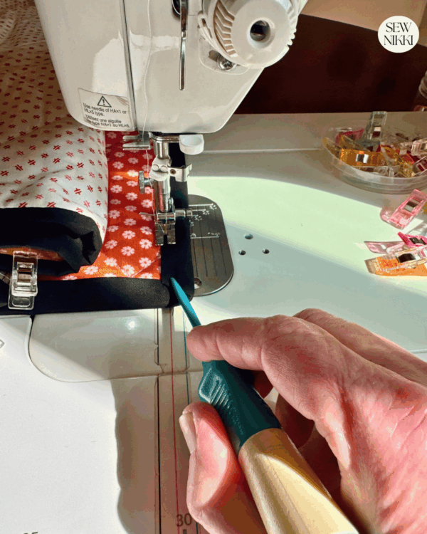 Use your stiletto when sewing on your binding at the corners by Sew Nikki