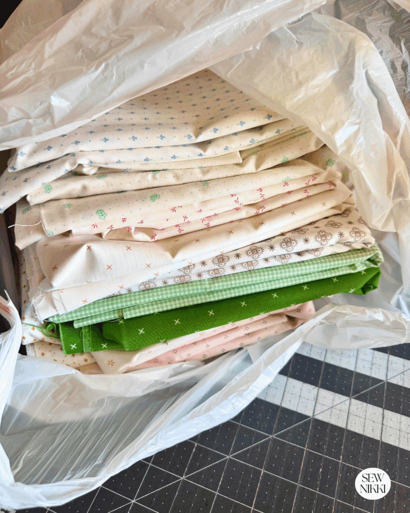 Here's a pile of fabric by the yard that was on sales at my local fabric store in the discounts racks by Sew Nikki