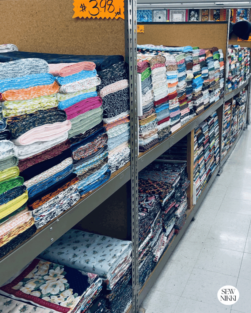Most local fabric stores will have a discount rack with off the bolt quality quilting fabric that is half the price of regular yardage by Sew Nikki
