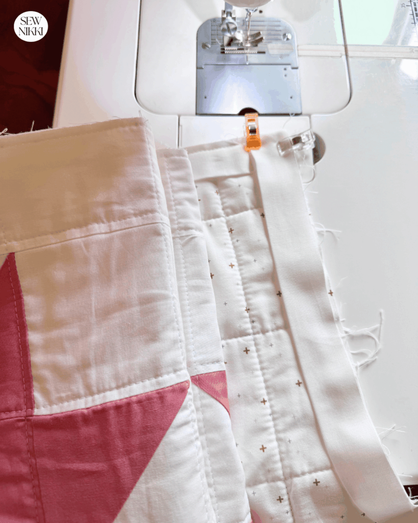 I machine bind one side of the quilt at a time, cut thread and then reroll and start fresh on the next side by Sew Nikki