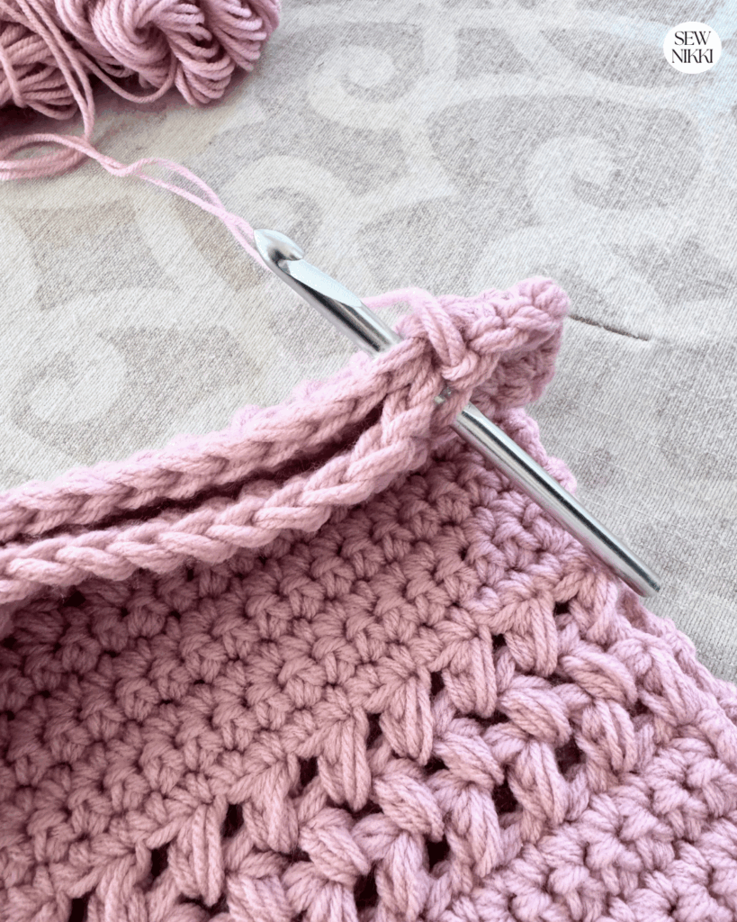 Close the sides of the market bag crochet pattern using single crochet stitches by Sew Nikki
