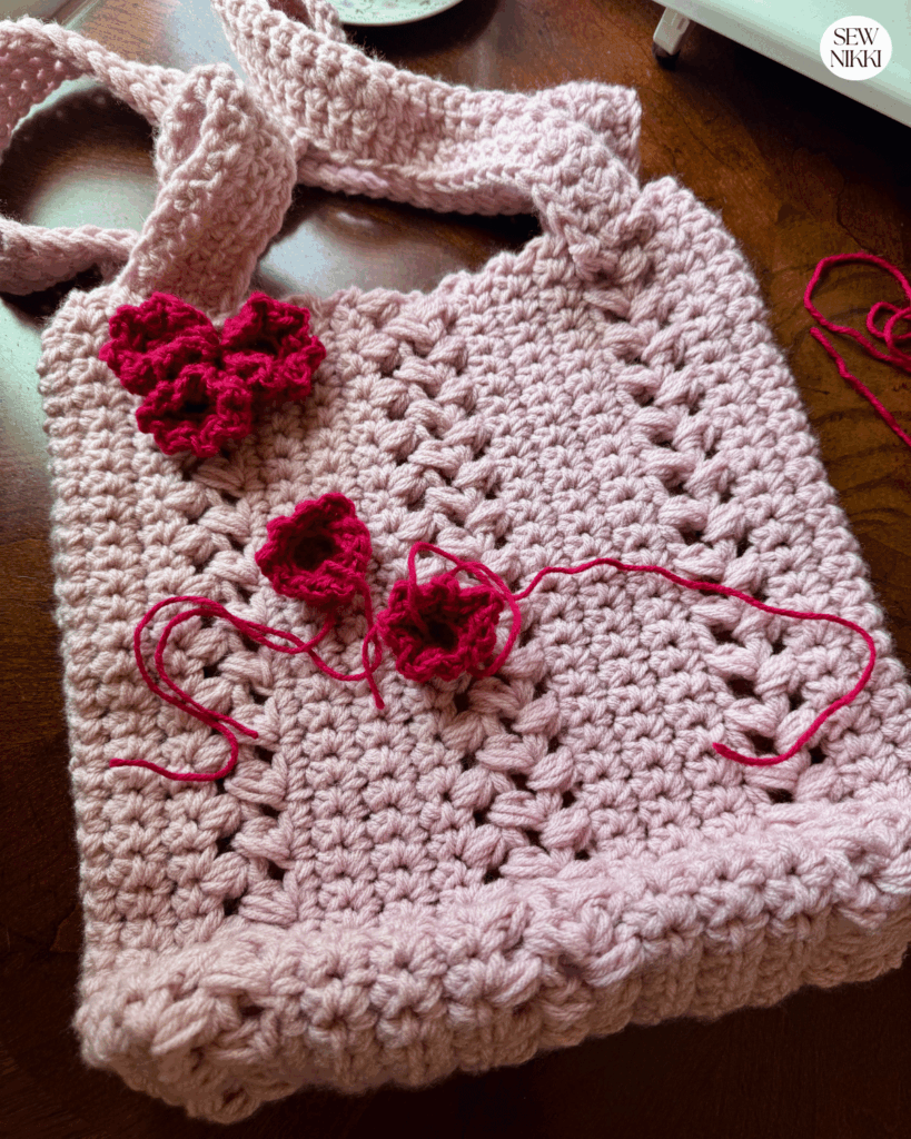 Flower Market Bag Crochet Pattern by Sew Nikki - adding crochet flowers to the outer bag.