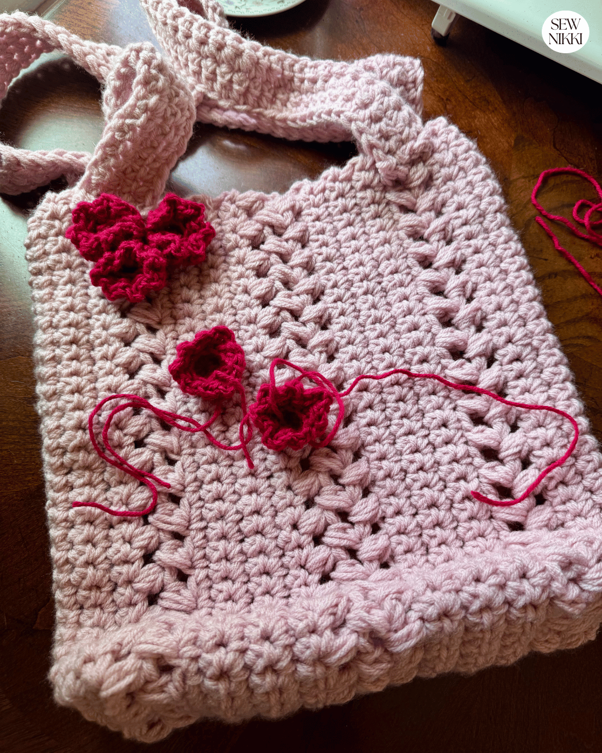 Flower Market Bag Crochet Pattern by Sew Nikki - adding crochet flowers to the outer bag.