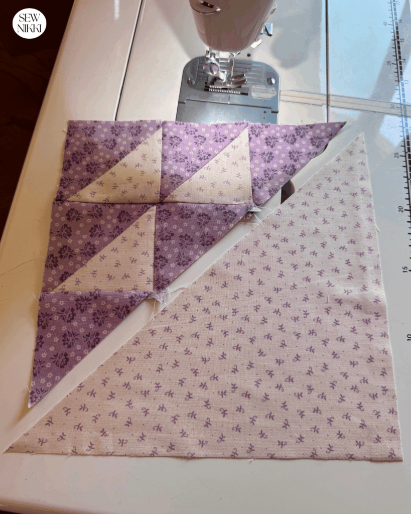 Birds in the Air quilt block - sew the large triangle to the diagonal edge of the other block section to finish by Sew Nikki
