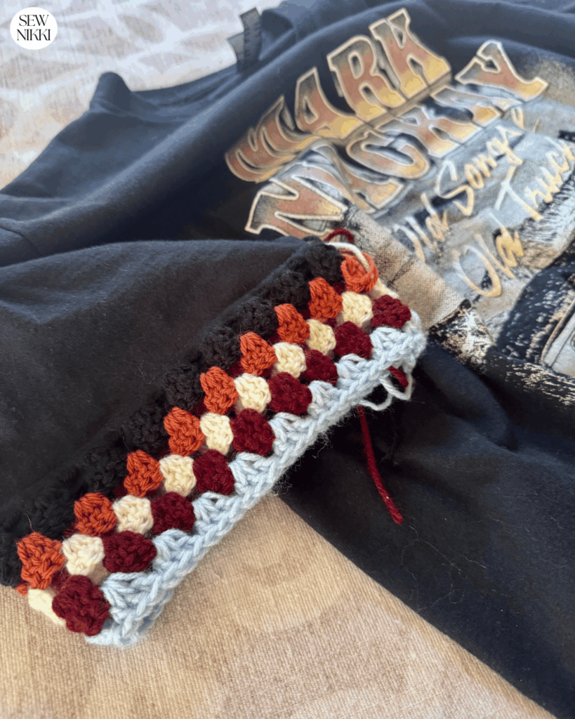 Make sure your sleeves aren't wider than the original t-shirt sleeve by check the first few rounds by Sew Nikki