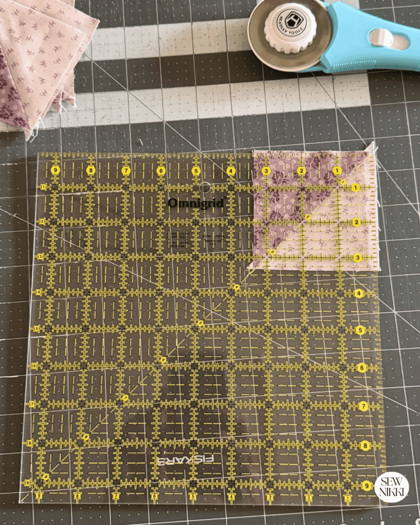 Making half square triangles and squaring them up to the right size by Sew Nikki