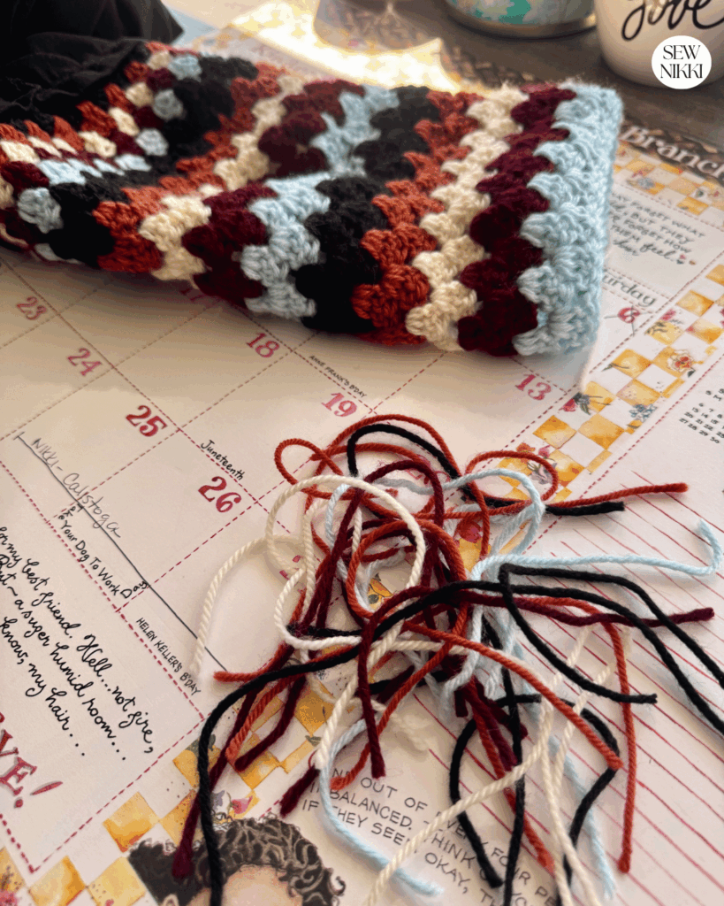 Pretty crochet sleeves pattern you can add to any top by Sew Nikki - just finished weaving all the tails.