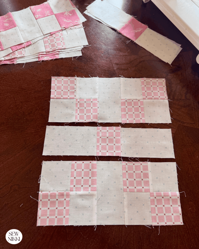 Block layout with units attached and formed into rows for Irish Chain quilt block by Sew Nikki
