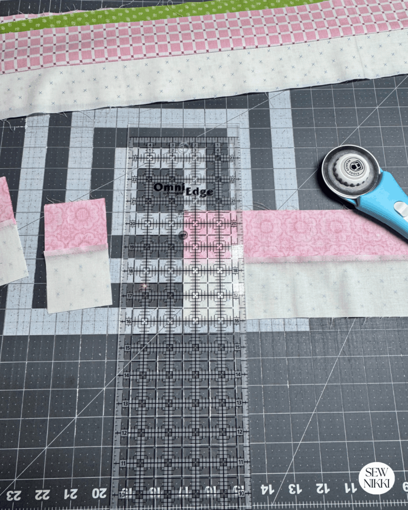 Sew jelly roll or fabric strips into rows and then sub-cut to make four patches by Sew Nikki