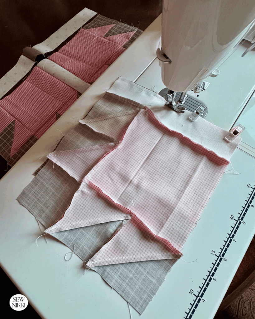 Adding the strip between the bear paw units by Sew Nikki