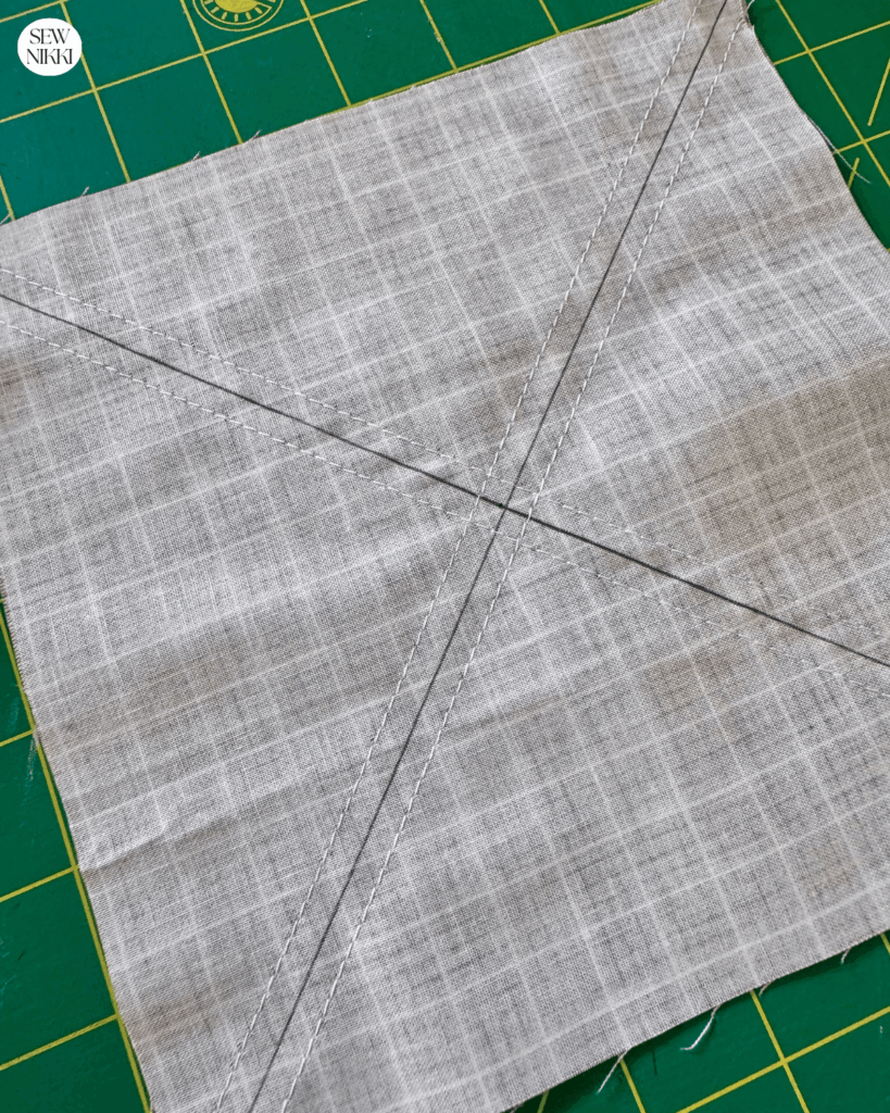 Half square triangle squares sewn along both diagonal lines by Sew Nikki