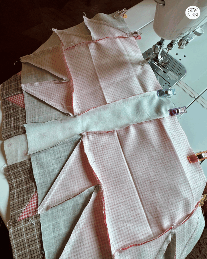 Sewing the final row of this quilt block and then press with iron by Sew Nikki