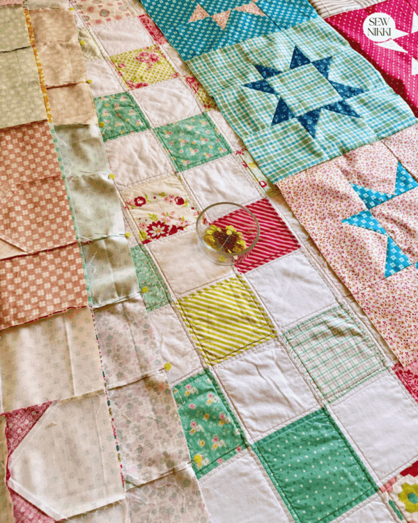 Sewing the rows together to finish this easy quilt top by Sew Nikki