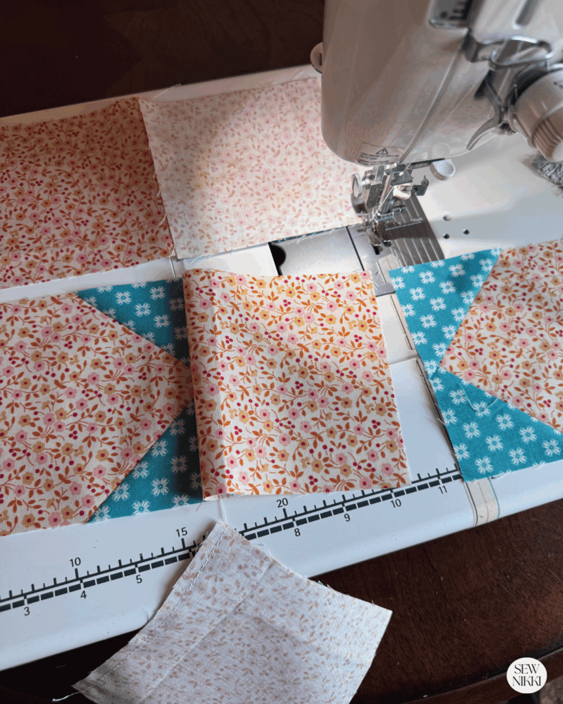 Sewing the star point quilt block rows together by Sew Nikki