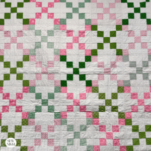 Single Irish Chain Variation Quilt Pattern by Sew Nikki - baby size version of this pattern with scrappy fabrics in green and pink.
