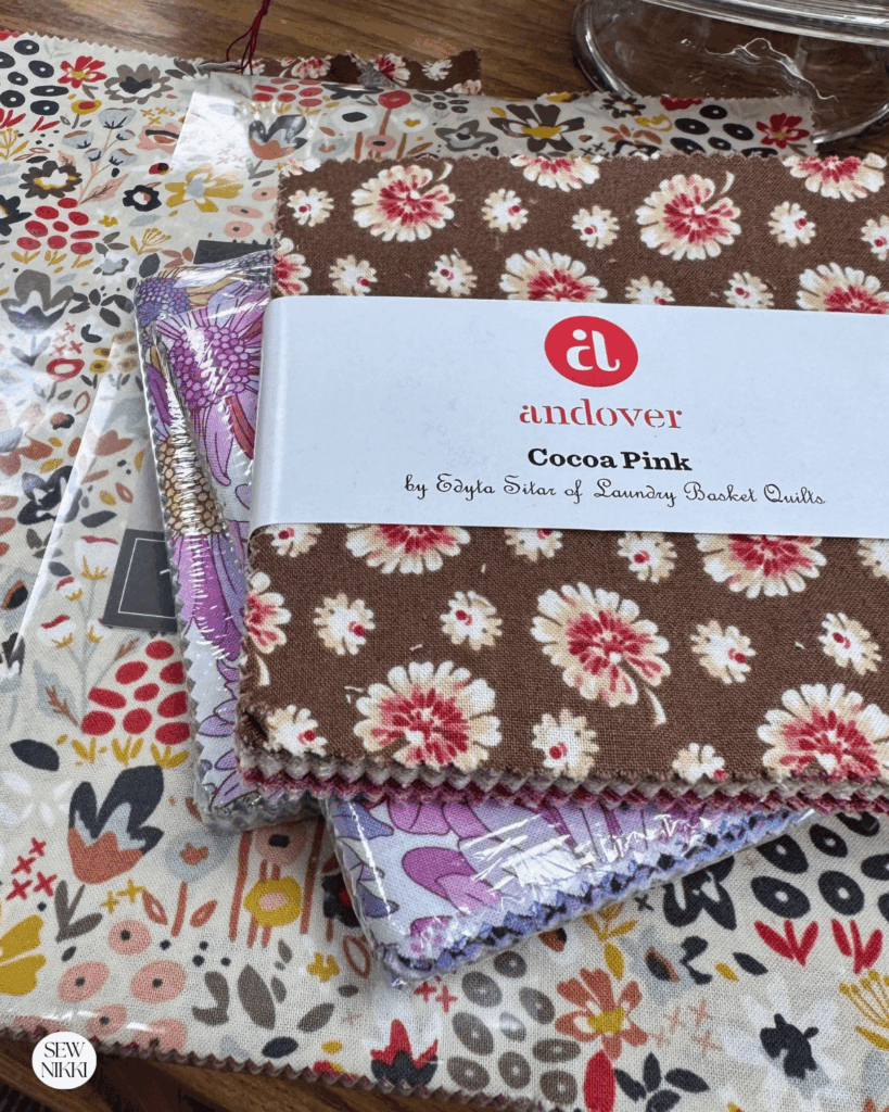 Some layer cakes and charm pack precuts are great for a first quilt by Sew Nikki