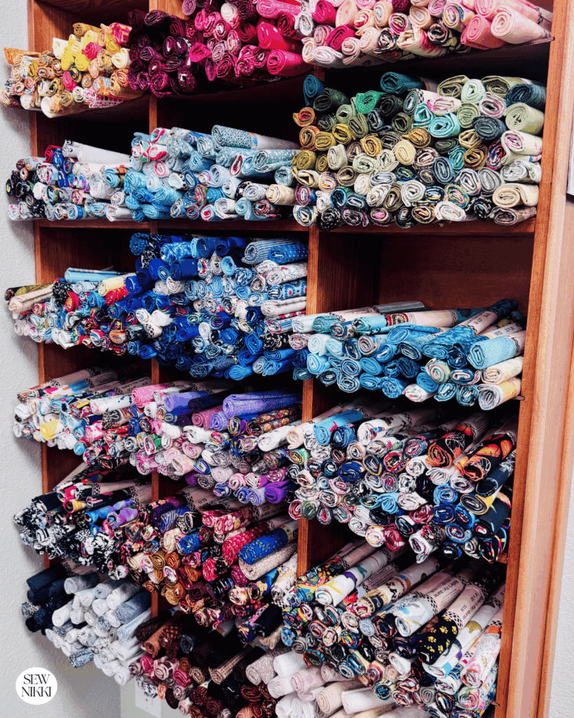 Wall of assorted fat quarters sold individually at a local quilt shop by Sew Nikki