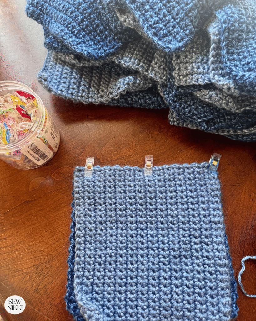Take two squares and place them right sides together then pin in place with clips by Sew Nikki